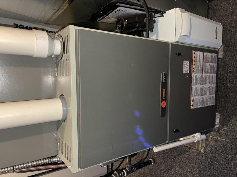 Performed scheduled furnace tune-up on residential gas furnace system. Inspected condensate drain system for proper operation and verified all PVC exhaust/intake piping connections were secure. Confirmed unit was operating with normal flame pattern and proper electrical connectivity as evidenced by functioning indicator lights.