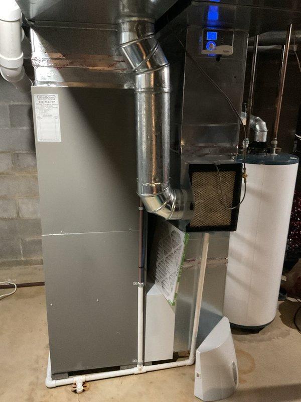 Completed routine MVP heating maintenance service in basement utility area. Inspected furnace system including ductwork, PVC venting, electrical connections, and heat exchanger components for proper operation. Verified control panel functionality and confirmed system is operating within normal parameters.