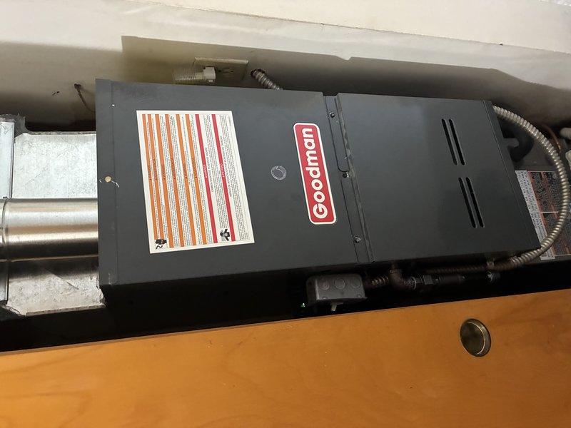 Responded to no-heat call for Goodman gas furnace. Inspection revealed faulty flame sensor as the root cause. Removed, cleaned, and reinstalled flame sensor electrode, restoring proper ignition and heat function.