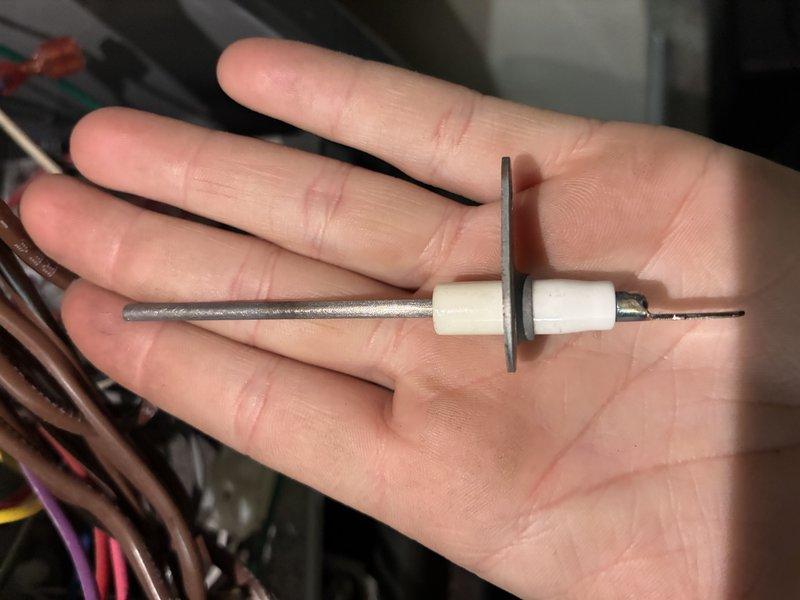 Responded to no-heat call for Goodman gas furnace. Inspection revealed faulty flame sensor as the root cause. Removed, cleaned, and reinstalled flame sensor electrode, restoring proper ignition and heat function.