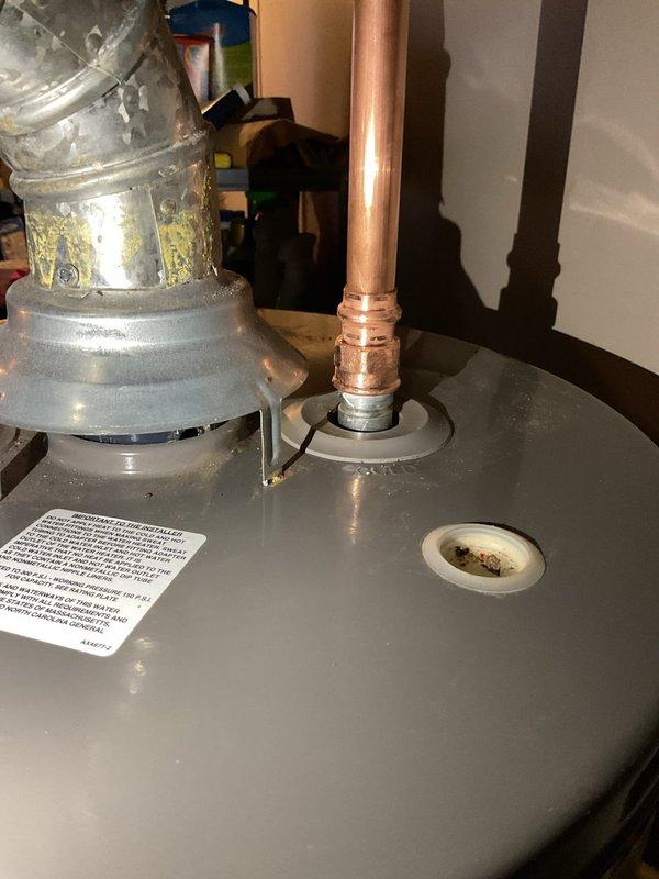Completed installation of an expansion tank on a 4-year-old Rheem water heater to bring system up to code. Removed failing dielectric connector on the cold inlet side and installed new connections from the ball valve to appropriate tie-in point. All components were properly staged and installed according to manufacturer specifications.