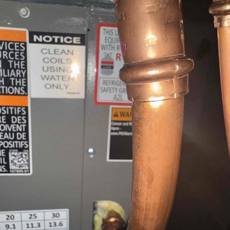 Performed seasonal A/C start-up and first maintenance service as indicated on installation invoice. Inspected copper refrigerant lines which showed normal condition with no signs of corrosion or leakage. Cleaned condenser coils using water only as per manufacturer specifications, ensuring optimal system performance for cooling season.