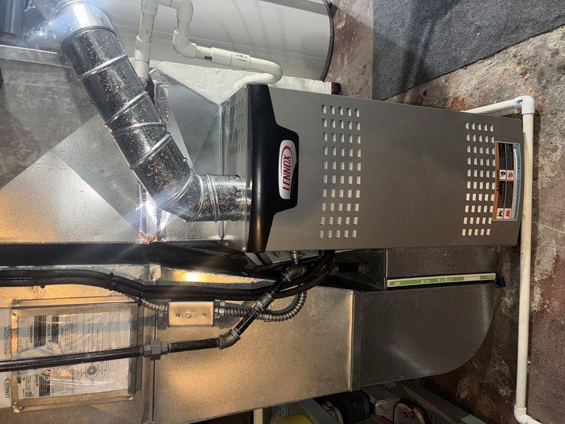 Performed routine MVP maintenance visit on 2-year-old Lennox furnace. Inspected entire system including ductwork connections, PVC ventilation piping, and electrical components. Noted oxidation on plumbing valve assembly near copper fittings, but system remains operational with no immediate concerns.