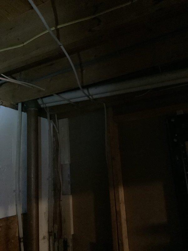 Conducted on-site evaluation of a 9-year-old furnace with confirmed cracked heat exchanger. Inspection of basement HVAC system revealed the existing furnace/air handler setup with attached humidifier requiring full replacement. Provided comprehensive replacement estimate for complete furnace and AC system with documentation of current installation configuration and structural considerations.