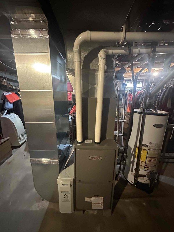 Successfully completed installation of a 90% efficiency furnace and air conditioning system in the basement mechanical room. Installed new Lennox furnace with proper PVC venting, connected to existing ductwork, and mounted a Kidde carbon monoxide detector to ensure safety compliance.