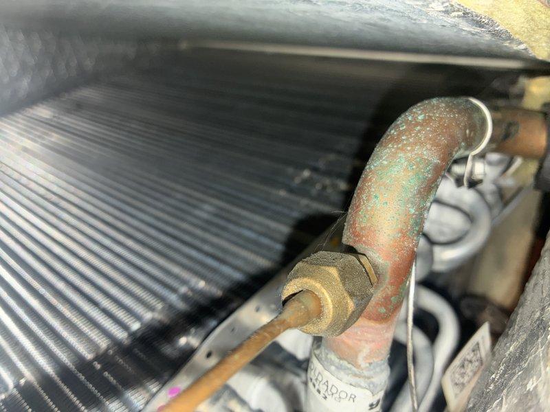 Performed scheduled maintenance on heating system. Inspected control board and electrical connections, noting all components functioning properly. Observed significant copper line oxidation and corrosion at heat exchanger connection; cleaned affected areas and verified proper operation of system.