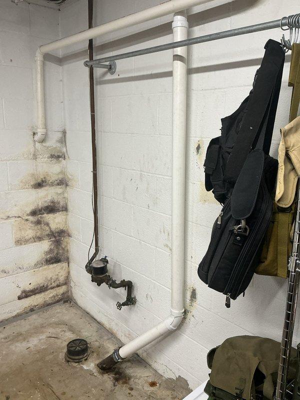 Completed replacement of kitchen drain line in basement area. Removed heavily clogged drain pipe containing significant buildup of sediment and organic waste material. Installed new PVC drain system with proper vertical and horizontal runs, addressing water damage and mold growth at wall/floor junction.