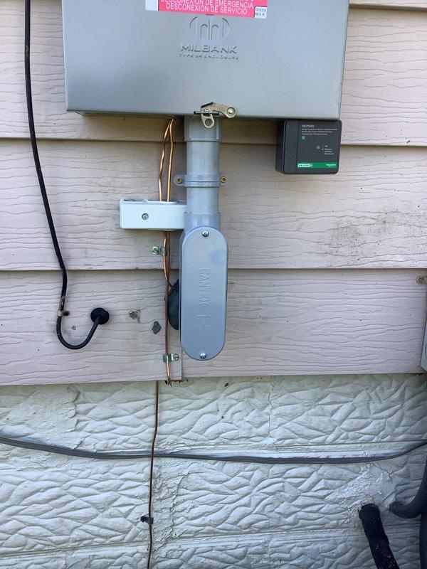 Completed 100A service upgrade with exterior disconnect installation in compliance with 2023 NEC requirements. Installed whole home surge protector (HEPD-80) and established dedicated furnace circuit. Updated grounding system to meet current code standards. Verified proper meter function and secure mounting of all electrical components.