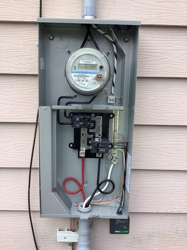 Completed 100A service upgrade with exterior disconnect installation in compliance with 2023 NEC requirements. Installed whole home surge protector (HEPD-80) and established dedicated furnace circuit. Updated grounding system to meet current code standards. Verified proper meter function and secure mounting of all electrical components.