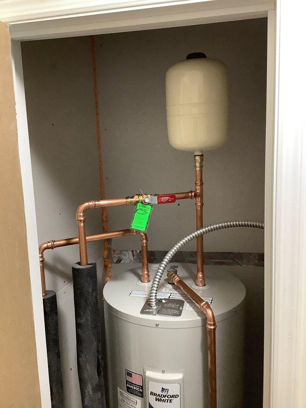 Successfully installed a new Bradford White 40-gallon electric water heater to replace customer's 2019 model that was no longer providing sufficient hot water. Installation included replacement of the cold water inlet valve, addition of a thermal expansion tank, updating of the drain pan, and hard piping of the water lines with proper insulation.
