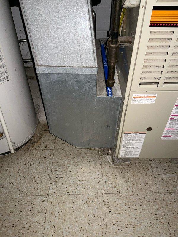 Completed inspection of a 20-year-old gas furnace in owner-occupied residence. System shows significant wear with patched ductwork and aging connections. Recommended full replacement of the existing unit due to age and condition, with quote provided for new high-efficiency system.