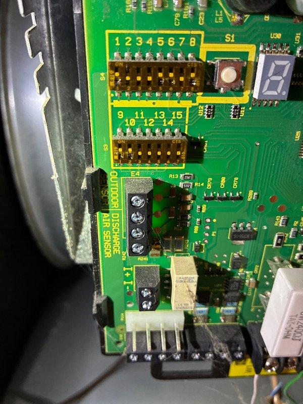 Performed routine heating system maintenance visit. Inspected the control board circuitry and connections, focusing on the outdoor sensor terminals and electronic components. Adjusted mechanical components using hex tool to ensure proper operation.