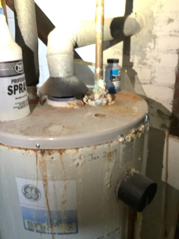 Performed camera inspection of plumbing system using electronic scope equipment. Identified corrosion and potential mineral buildup in pipes. Also noted significant deterioration and corrosion at water heater connections with evidence of previous leakage, particularly around the top fittings where copper and PVC lines connect.