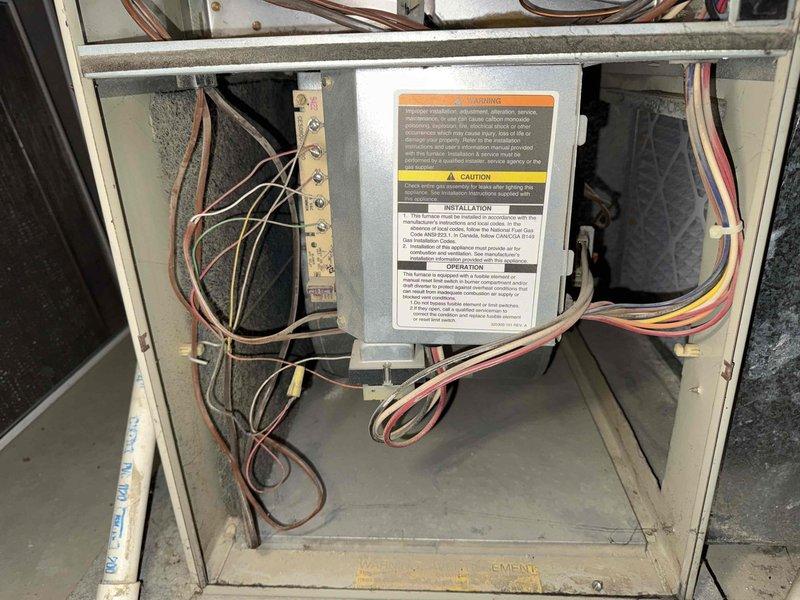 Diagnosed 32-year-old gas furnace with no heat complaint; system showing blower operation but flame failure. Visual inspection revealed deteriorated ignition components and extensive wiring degradation consistent with equipment age. Recommended full system replacement due to safety concerns and unavailability of replacement parts for this obsolete model.