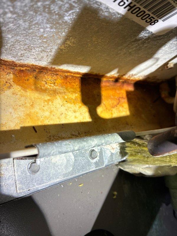 Performed scheduled MVP Heating Visit, inspecting system components and identifying significant oxidation on interior metal surfaces. Used specialized tools to access and evaluate components, documenting rusting on heat exchanger shelf that may require monitoring for future deterioration.