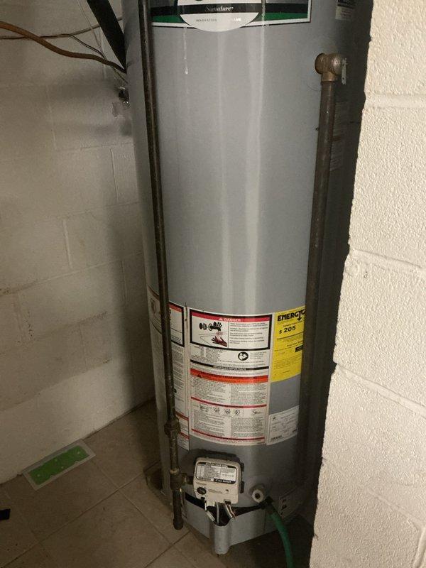 Performed scheduled maintenance on conventional tank water heater system, including complete flush and fill procedure to remove sediment buildup. Inspected expansion tank and pressure relief valve for proper operation, confirming all connections were secure with no signs of leakage. System returned to service in optimal working condition with appropriate temperature settings verified.