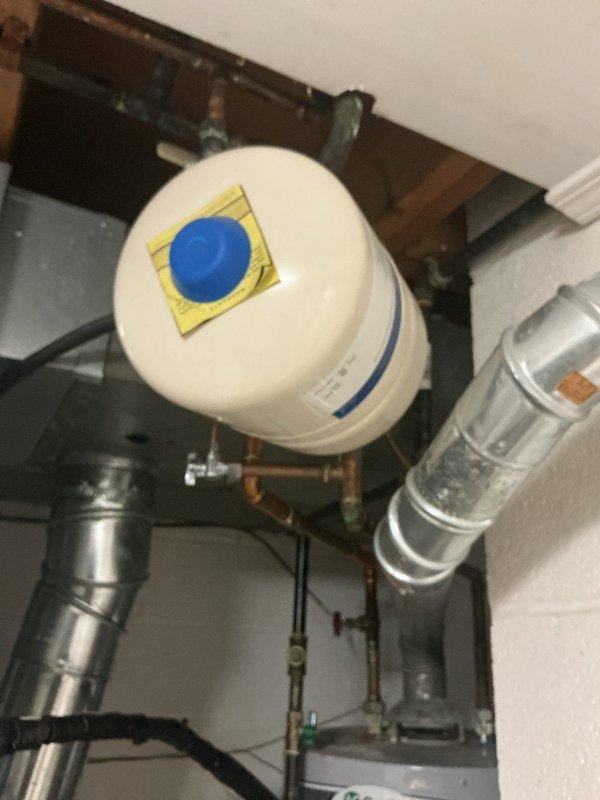Performed scheduled maintenance on conventional tank water heater system, including complete flush and fill procedure to remove sediment buildup. Inspected expansion tank and pressure relief valve for proper operation, confirming all connections were secure with no signs of leakage. System returned to service in optimal working condition with appropriate temperature settings verified.