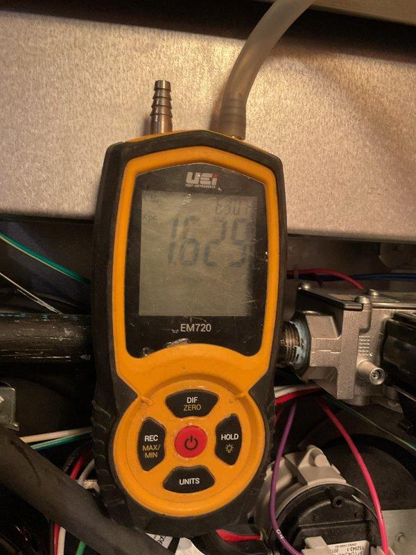 Performed annual maintenance on 3-year-old cooling system. Conducted static pressure testing with UEi EM720 meter, measuring 7.889 inH2O at 60.8°F. Verified refrigerant system operation with temperature readings of 162.5°F. System is functioning within manufacturer specifications after service.