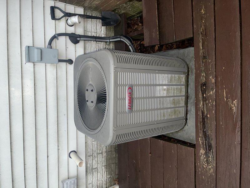 Performed standard cooling maintenance service on Lennox AC unit. Inspected outdoor condenser, electrical disconnect box, refrigerant lines, and drainage system. All components functioning properly with no issues detected.