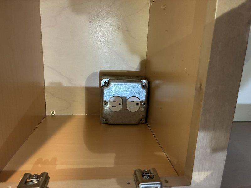 Performed multiple electrical repairs including replacement of a damaged GFCI receptacle near refrigerator, installation of a new outlet in place of an old disposal switch, and surface mounting of a microwave junction box in the cabinet. Additionally, replaced a burnt outlet near the front door, reset a bedroom electrical box, and properly grounded a kitchen GFCI on the laundry room wall to restore safe functionality throughout the residence.