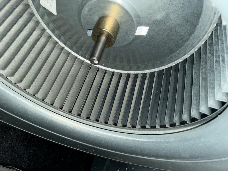 Performed a routine MVP heating service which included inspection of the blower wheel assembly and motor components. Examined the fan blades, hub connection, and shaft for proper operation and condition. Inspected the motor wiring connections (red, orange, purple, green, and white) and verified all electrical components were properly secured and functioning according to manufacturer specifications.