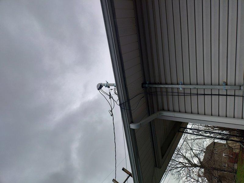 Completed 100A exterior service replacement with grounding updates. Installation required 1-1/4" PVC conduit and 2" galvanized pipe for proper service connection. Successfully mounted new service equipment to building exterior and established proper grounding system per code requirements.