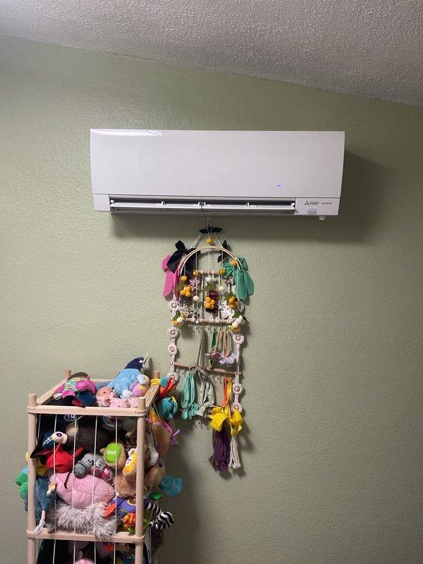 Performed routine maintenance and tune-up on a 2-year-old Mitsubishi ductless mini-split heat pump system. Inspected indoor wall-mounted unit in residential setting, confirming proper operation and condition. System appears well-maintained with no visible issues or required repairs identified during service.