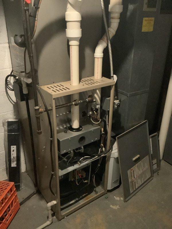 Successfully installed a 90% efficient furnace as a secondary heating system in the basement/utility room. The installation included proper connection of PVC ventilation piping, secure mounting of the unit, and complete wiring of all control mechanisms. Final inspection showed all components properly sealed and functioning according to manufacturer specifications.