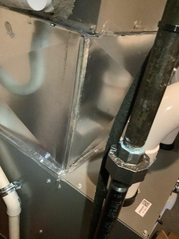 Successfully installed a 90% efficient furnace as a secondary heating system in the basement/utility room. The installation included proper connection of PVC ventilation piping, secure mounting of the unit, and complete wiring of all control mechanisms. Final inspection showed all components properly sealed and functioning according to manufacturer specifications.