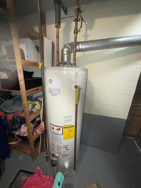 Performed maintenance on 20+ year old furnace, noting significant rust and corrosion on heat exchanger and evaporator coil that requires attention. Visual inspection revealed accumulated dust/debris in interior chamber and aging components, indicating system is approaching end of useful life and should be considered for replacement.