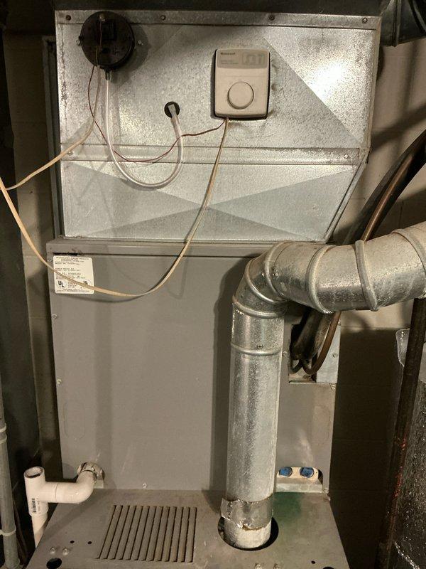 Completed inspection of a 25-year-old HVAC system requiring replacement. System includes furnace unit with associated electrical components, Aprilaire #401 humidifier, and PVC condensate drainage. Documented current installation configuration and provided estimate for complete system replacement.