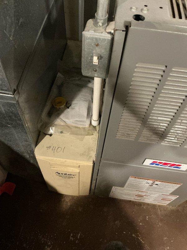 Completed inspection of a 25-year-old HVAC system requiring replacement. System includes furnace unit with associated electrical components, Aprilaire #401 humidifier, and PVC condensate drainage. Documented current installation configuration and provided estimate for complete system replacement.