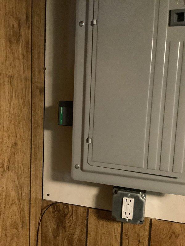 Performed diagnostic inspection of 200A electrical panel following reported power surge that affected kitchen appliances. Visual examination confirmed panel is in normal working condition with no visible damage to circuit breakers or internal components. Determined that previous fire damage in breaker box (caused by vehicle-pole collision) was properly repaired, and current appliance failures are unrelated to that incident.