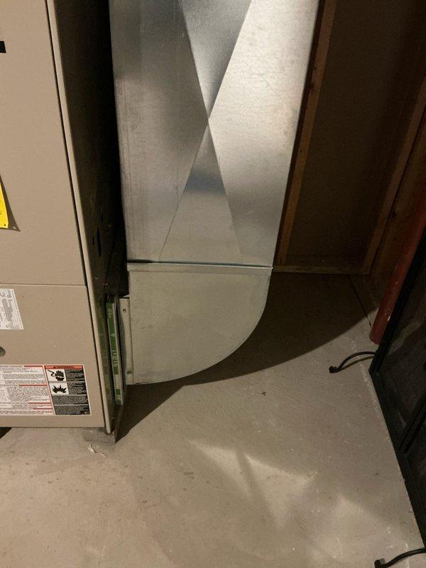 Performed inspection of 24-year-old Lennox HVAC system in utility room. System shows significant age-related wear with open access panels revealing internal components. Documented existing ductwork configuration, gas line connections, and PVC exhaust/intake pipes for proper replacement estimation. Recommended full furnace and air conditioning replacement due to system age and condition.