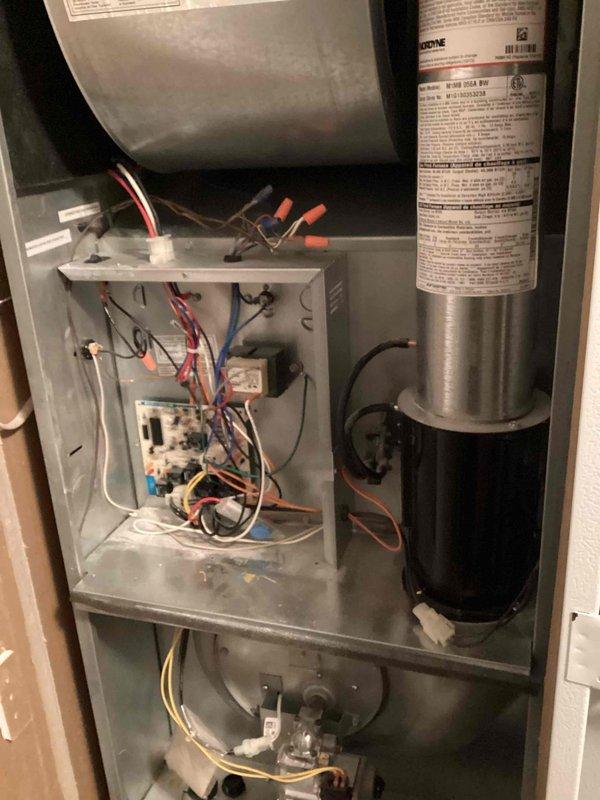 Performed scheduled maintenance on 8-year-old furnace. Inspected interior components including circuit board, gas valve assembly, and blower motor. Cleaned dust accumulation from key components and verified all electrical connections were secure with no signs of damage or wear.