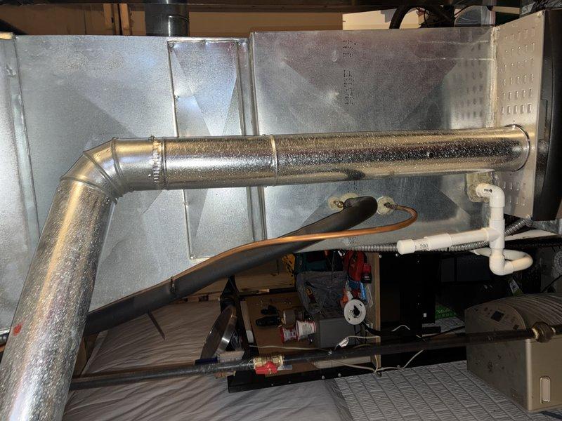 Completed heating system maintenance on unit of unknown age. Inspected ductwork, insulation, and drainage components in utility area. Checked quarter-turn ball valve with proper thread seal tape on supply line; system functioning normally after service.