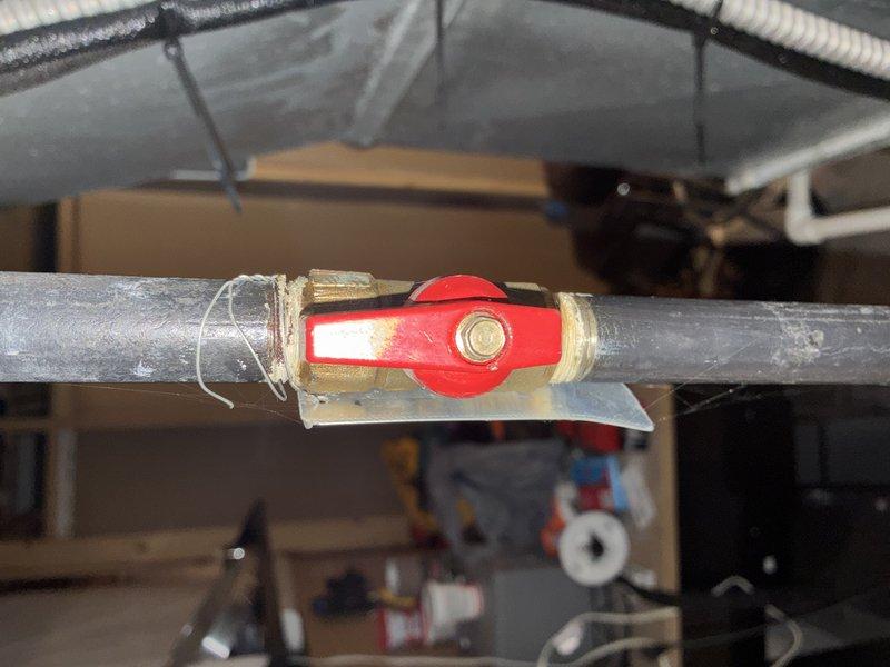 Completed heating system maintenance on unit of unknown age. Inspected ductwork, insulation, and drainage components in utility area. Checked quarter-turn ball valve with proper thread seal tape on supply line; system functioning normally after service.