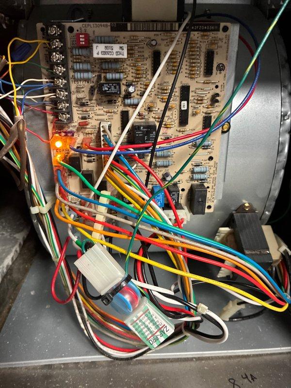 Performed scheduled maintenance on 9-year-old cooling system. Inspected control board functionality (confirmed by illuminated LED indicator) and documented refrigerant line filter installation with service date. System operating normally with no issues detected.