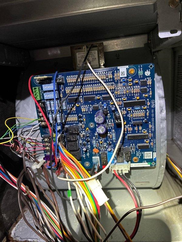 Performed complimentary cooling system maintenance for MVP member. Inspected circuit board connections and wiring in air handler, finding all components properly connected. Noted significant dirt accumulation on air filter with visible orange-brown staining, indicating filter replacement is needed for optimal system performance.