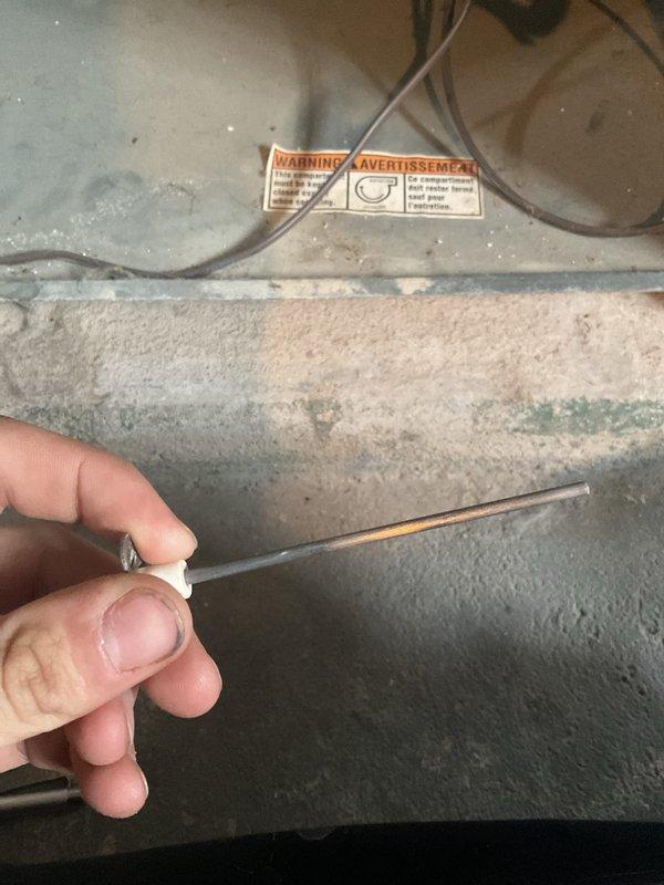 Performed routine MVP maintenance service on 16+ year old heating system. Inspected blower wheel assembly and found light dust accumulation. Conducted flame sensor testing with probe tool to ensure proper ignition and system operation.