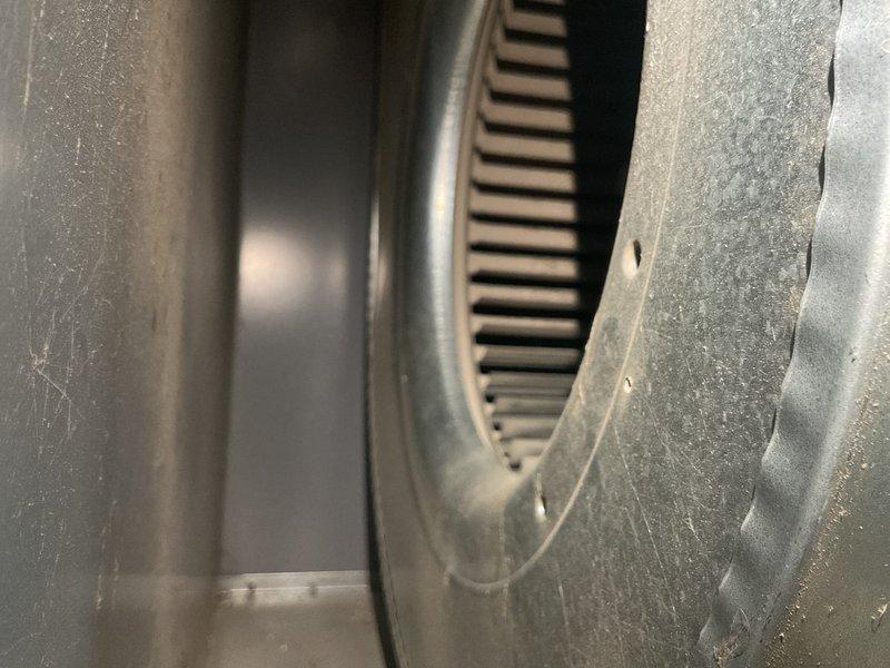 Performed routine MVP maintenance service on 16+ year old heating system. Inspected blower wheel assembly and found light dust accumulation. Conducted flame sensor testing with probe tool to ensure proper ignition and system operation.