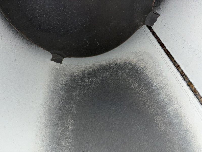 Responded to no-heat call for 30+ year old gas furnace. Diagnostic inspection revealed carbon buildup on heat exchanger components and significant soot deposits, indicating potential combustion issues. Determined unit has cracked heat exchanger requiring full system replacement due to age and safety concerns.