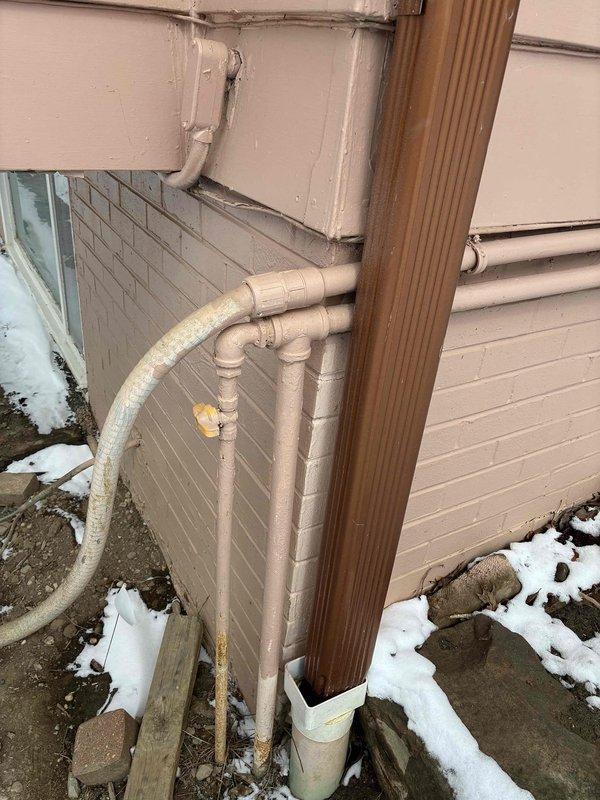 Conducted an assessment of knob and tube wiring in two rooms requiring rewiring. Exterior inspection revealed weathered utility connections with PVC piping showing signs of aging and discoloration. No immediate electrical hazards were identified, but recommended complete rewiring to bring system up to current code standards.