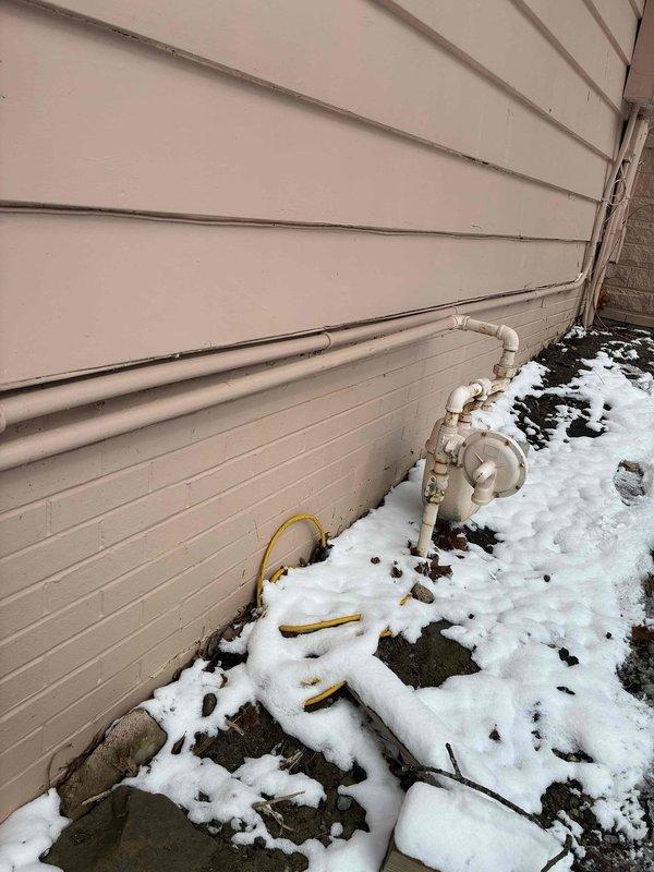 Conducted an assessment of knob and tube wiring in two rooms requiring rewiring. Exterior inspection revealed weathered utility connections with PVC piping showing signs of aging and discoloration. No immediate electrical hazards were identified, but recommended complete rewiring to bring system up to current code standards.