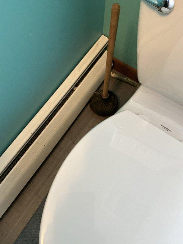 Conducted sewer line inspection in 1973 home with reported basement water intrusion despite previous waterproofing efforts. Examined bathroom fixtures and surrounding areas for potential connection to water issues; verified proper toilet installation and checked for any leaks that might contribute to basement moisture problems.