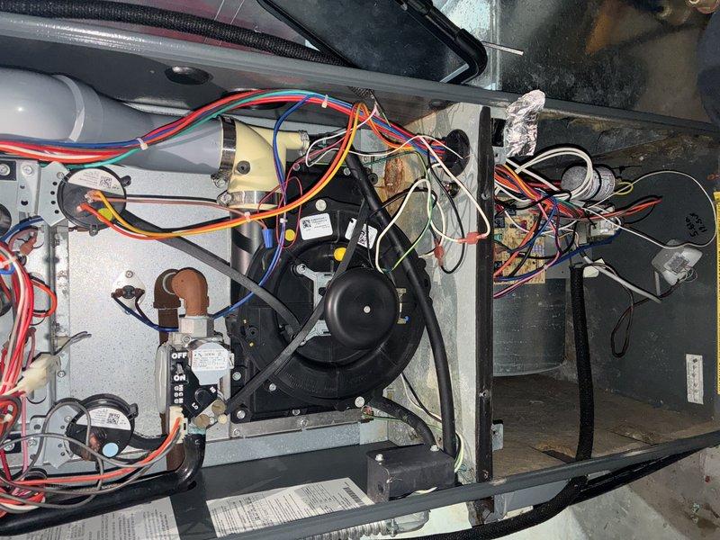 Performed routine heating maintenance on 16-year-old HVAC system. Inspected blower motor assembly and electrical connections, documenting all components with photos. Confirmed proper operation of residential heating unit.