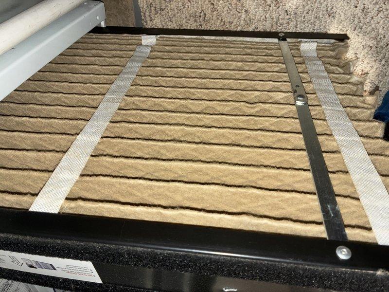 Completed routine maintenance on two MVP furnace units as scheduled. Inspected and verified proper installation of air filter in ventilation system, which was found to be in good condition with no visible damage or excessive dirt buildup. Examined plumbing components including brass shut-off valve with red handle, noting minor corrosion/mineral deposits but confirming proper functionality.