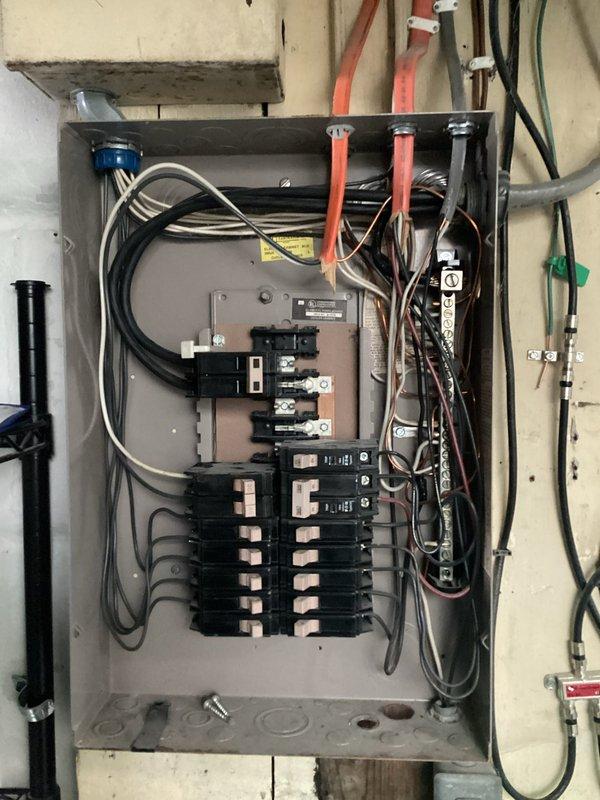 Performed comprehensive assessment of existing electrical panel system, documenting junction box conditions and current breaker configuration. Prepared detailed quote for panel replacement, EV charger installation, and wiring updates to bring system up to current electrical code standards. No service call fee applied.