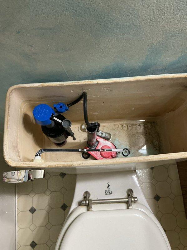 Reconnected internal toilet components in 40-year-old home. Inspected tank mechanism including float ball assembly and flush valve. Completed service and tested for proper functionality.
