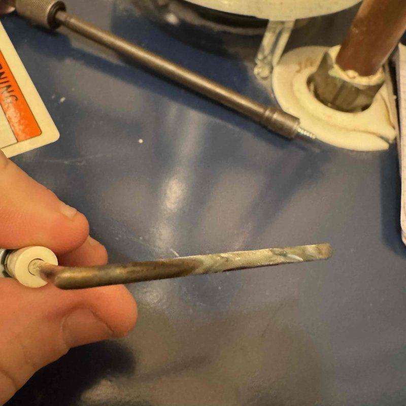 Performed comprehensive furnace tune-up including inspection of heating element which showed signs of wear and mineral deposits. Conducted pressure testing with digital gauge, documenting readings of 352/-356, indicating system is operating within acceptable parameters. Inspected all plumbing connections and verified proper installation of components.